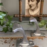 Pair of cast aluminum coat hooks