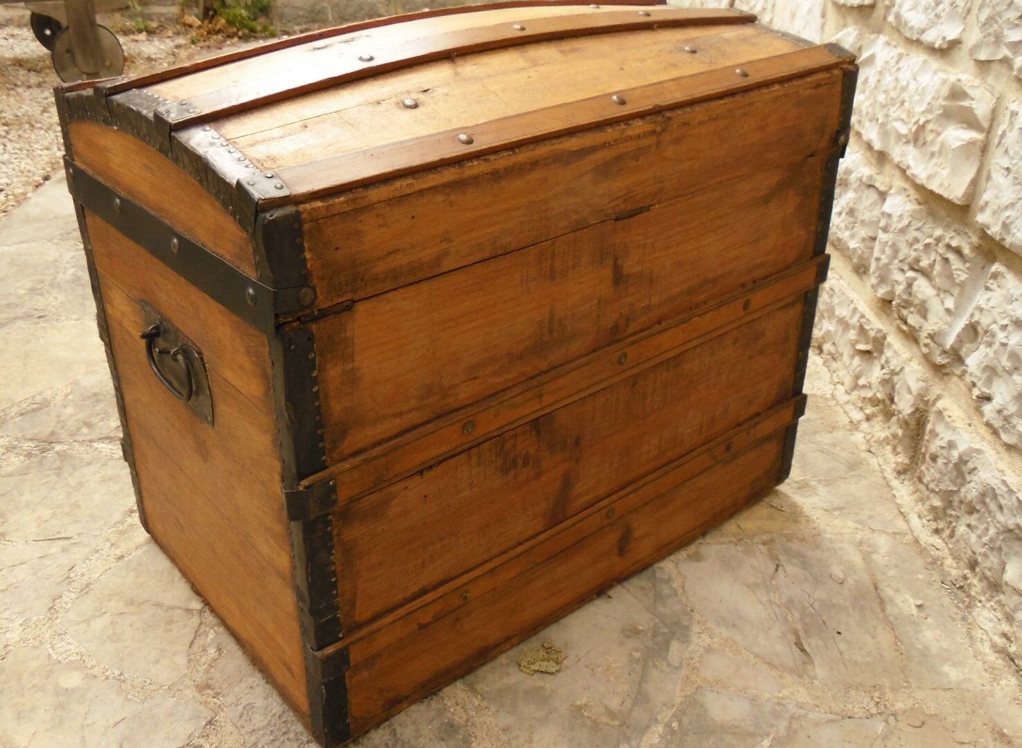 Ancient travel trunk, bulging wooden chest