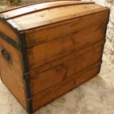 Ancient travel trunk, bulging wooden chest