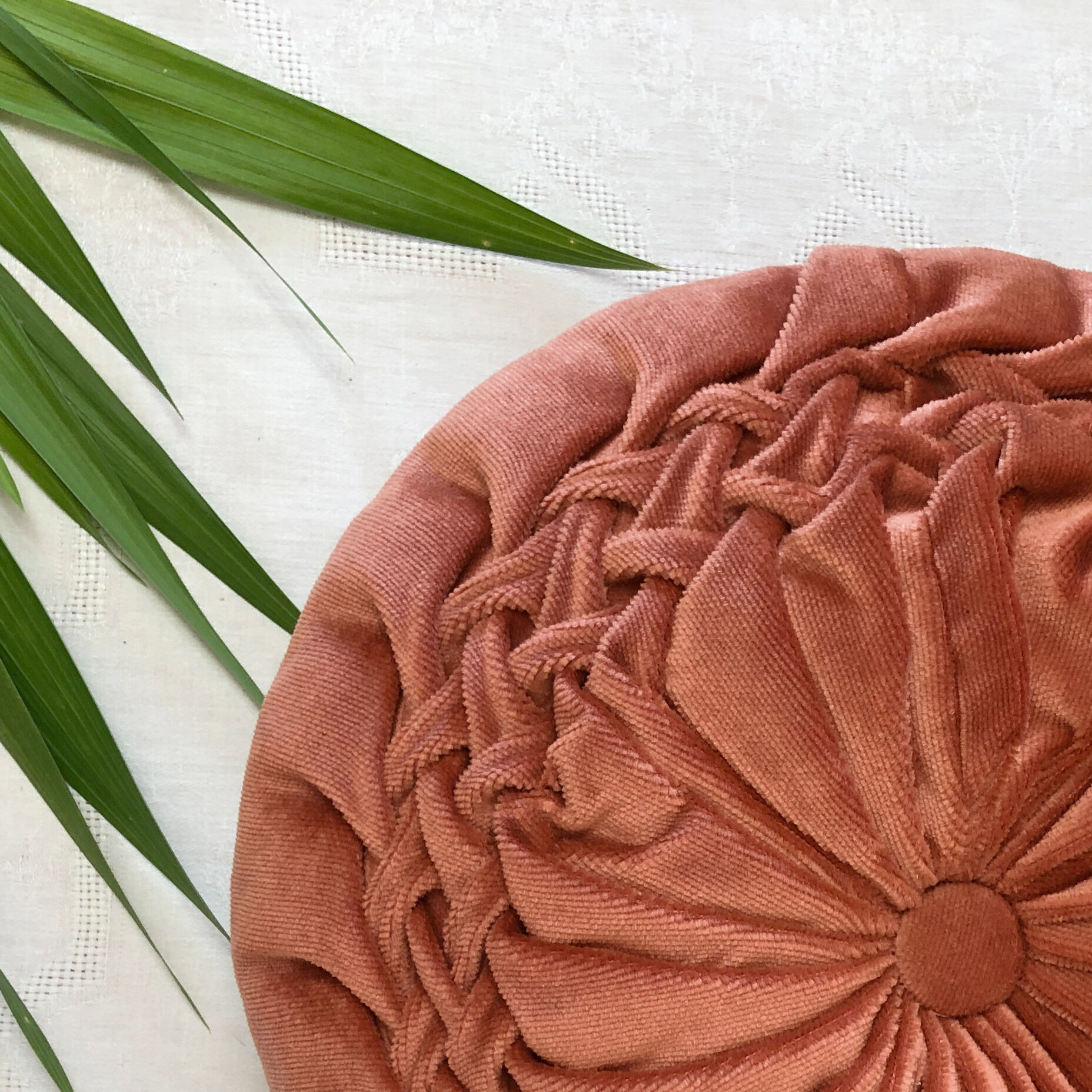 Round orange velvet cushion