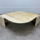 Table basse travertin forme œil par Roche Bobois