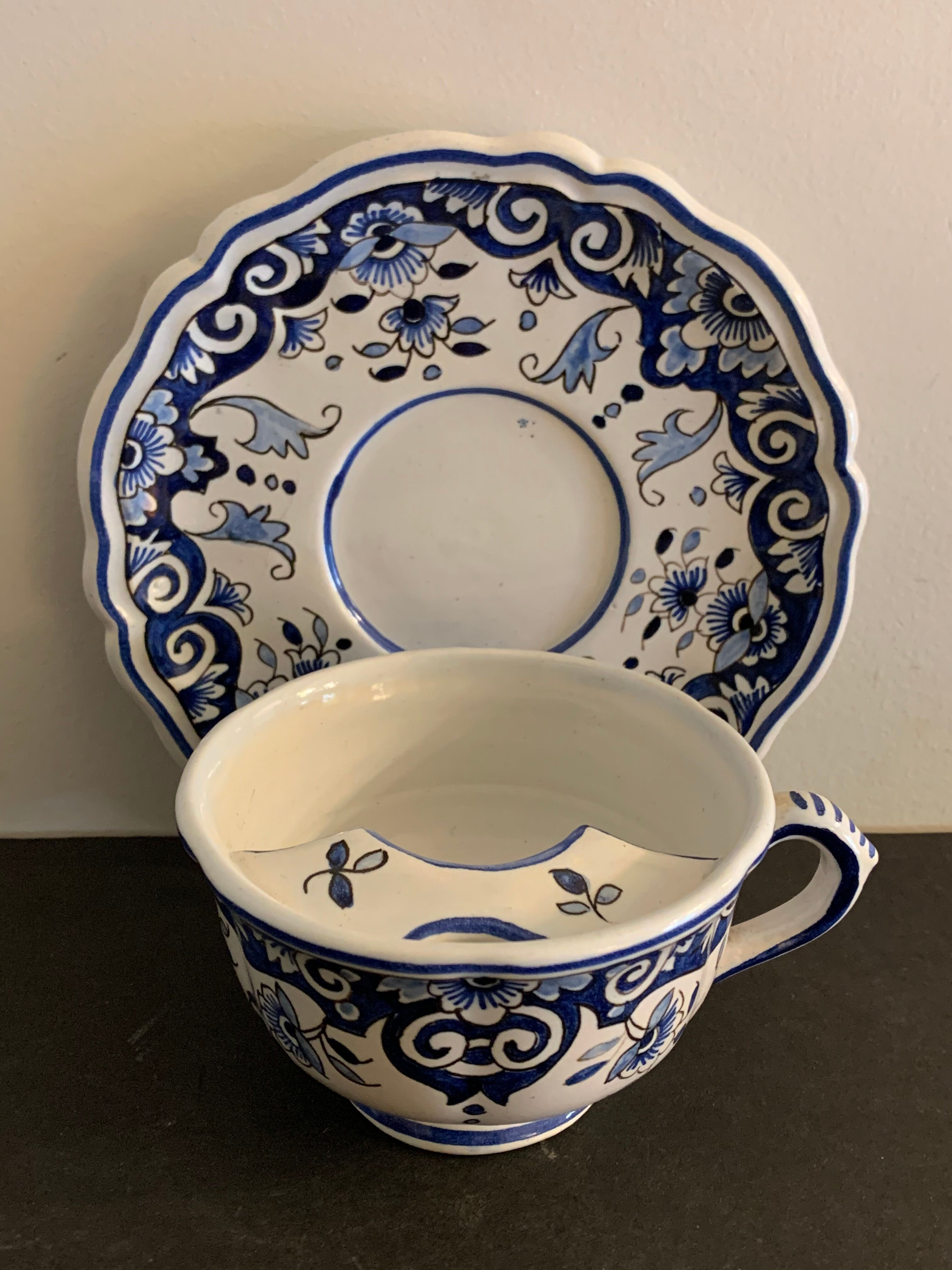 Old mustache cup and its under cup, Rouen earthenware