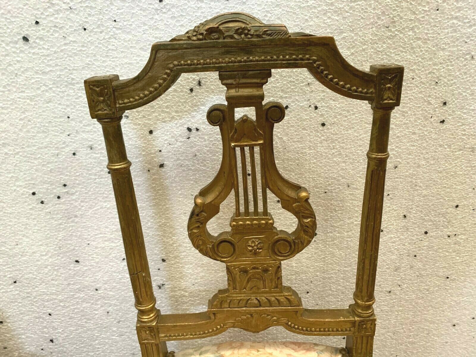 Pair of Louis XVI style chairs in 20th century gilded wood