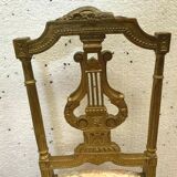 Paire de chaises de style Louis XVI en bois doré XX siècle