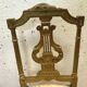 Paire de chaises de style Louis XVI en bois doré XX siècle