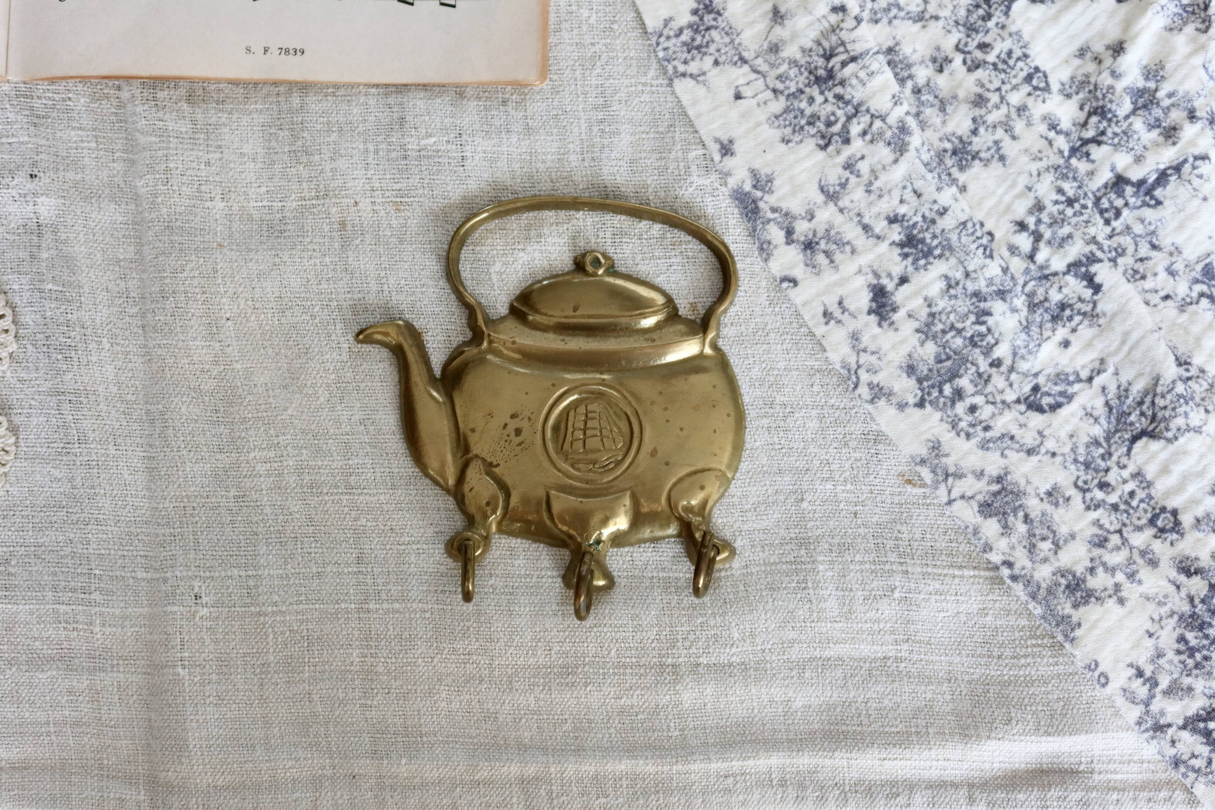 Vintage teapot-shaped brass coat hook