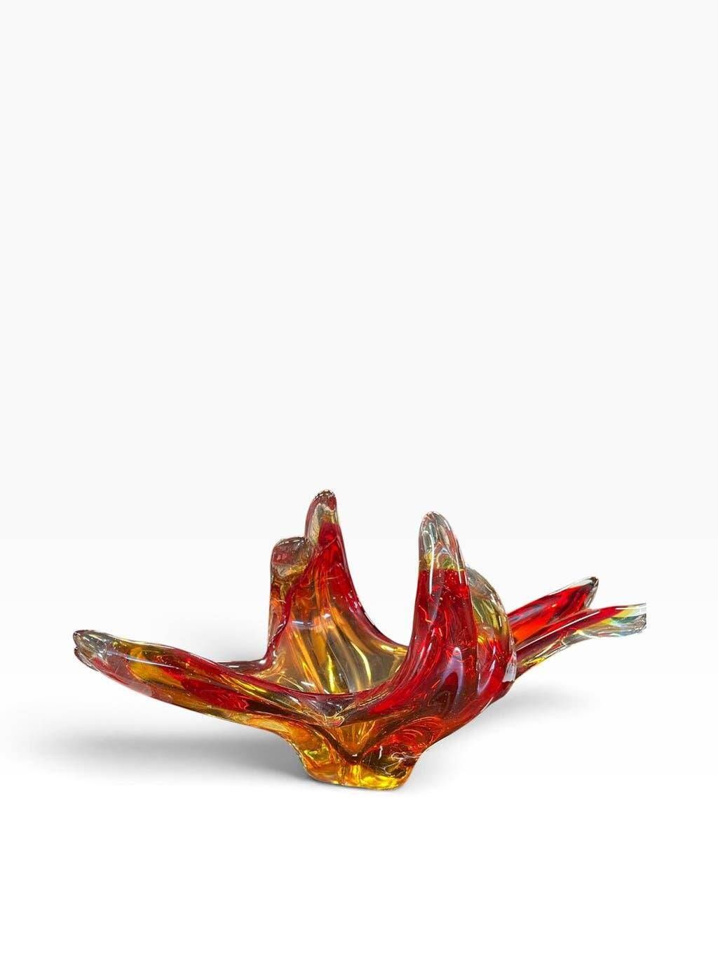 Vintage Murano glass bowl/plate in orange-red with swirling patterns.