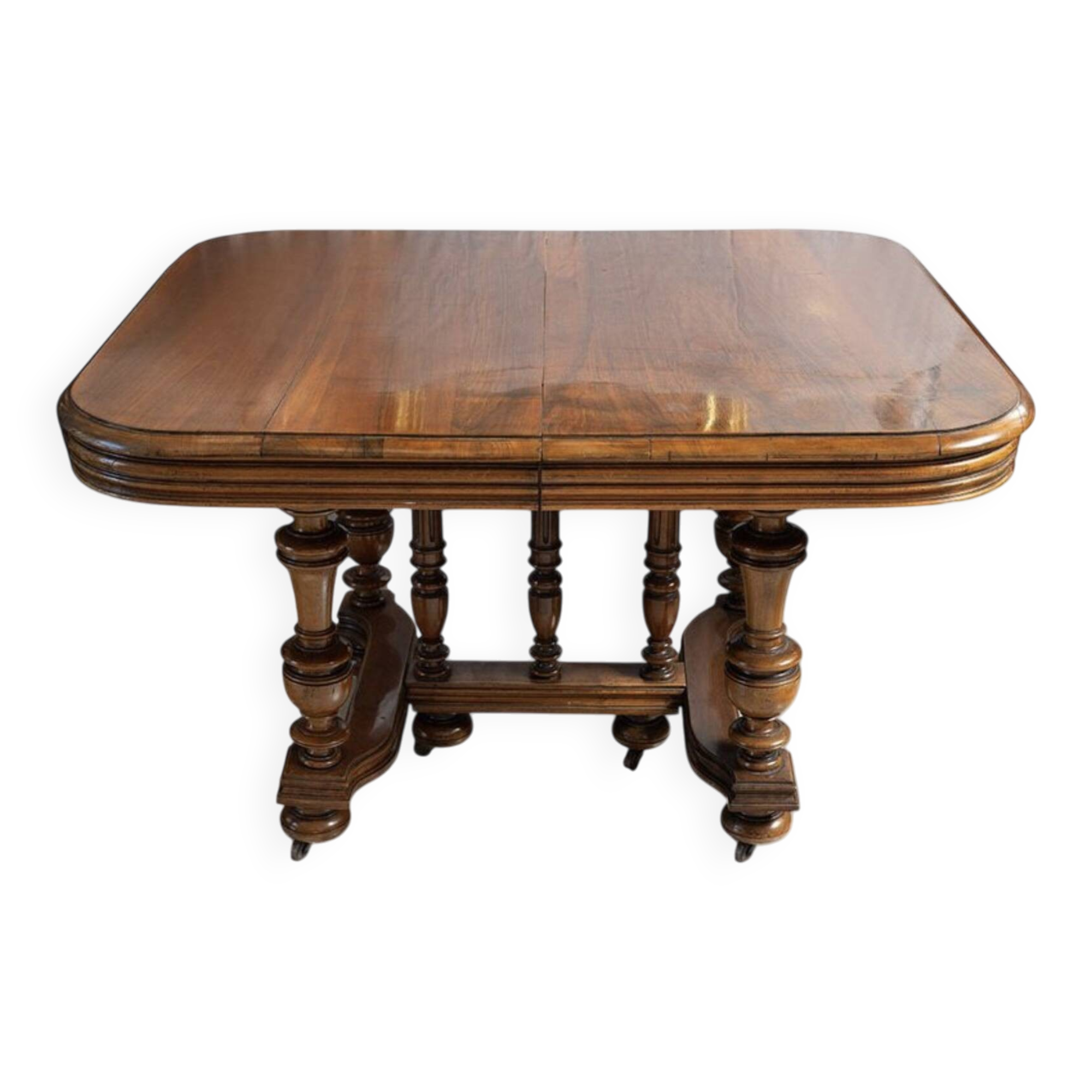 Extendable wheeled table henri ii, second half of the 19th century, solid walnut.
