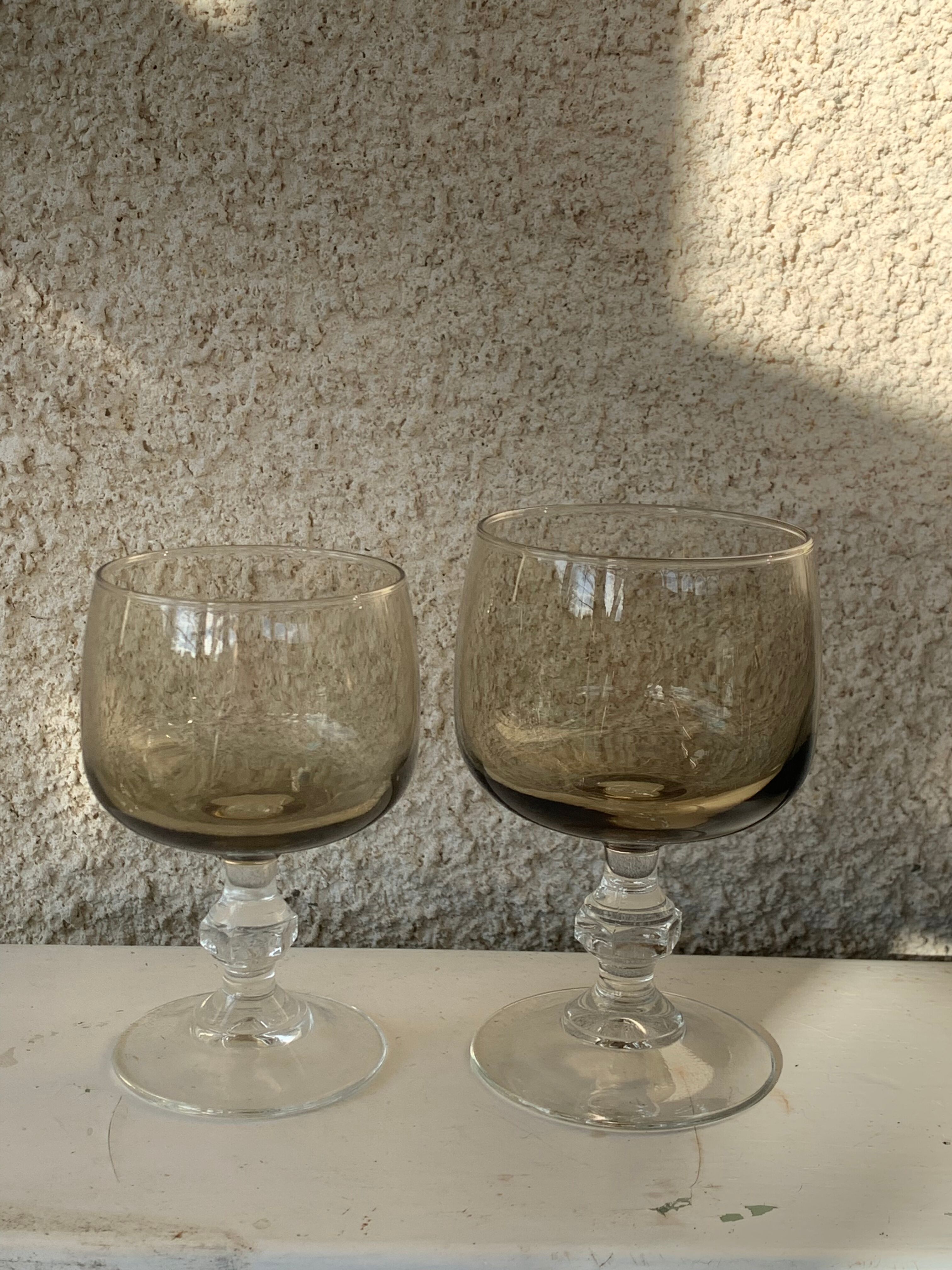 11 wine and water glasses in smoked grey glass and transparent base vintage 1970