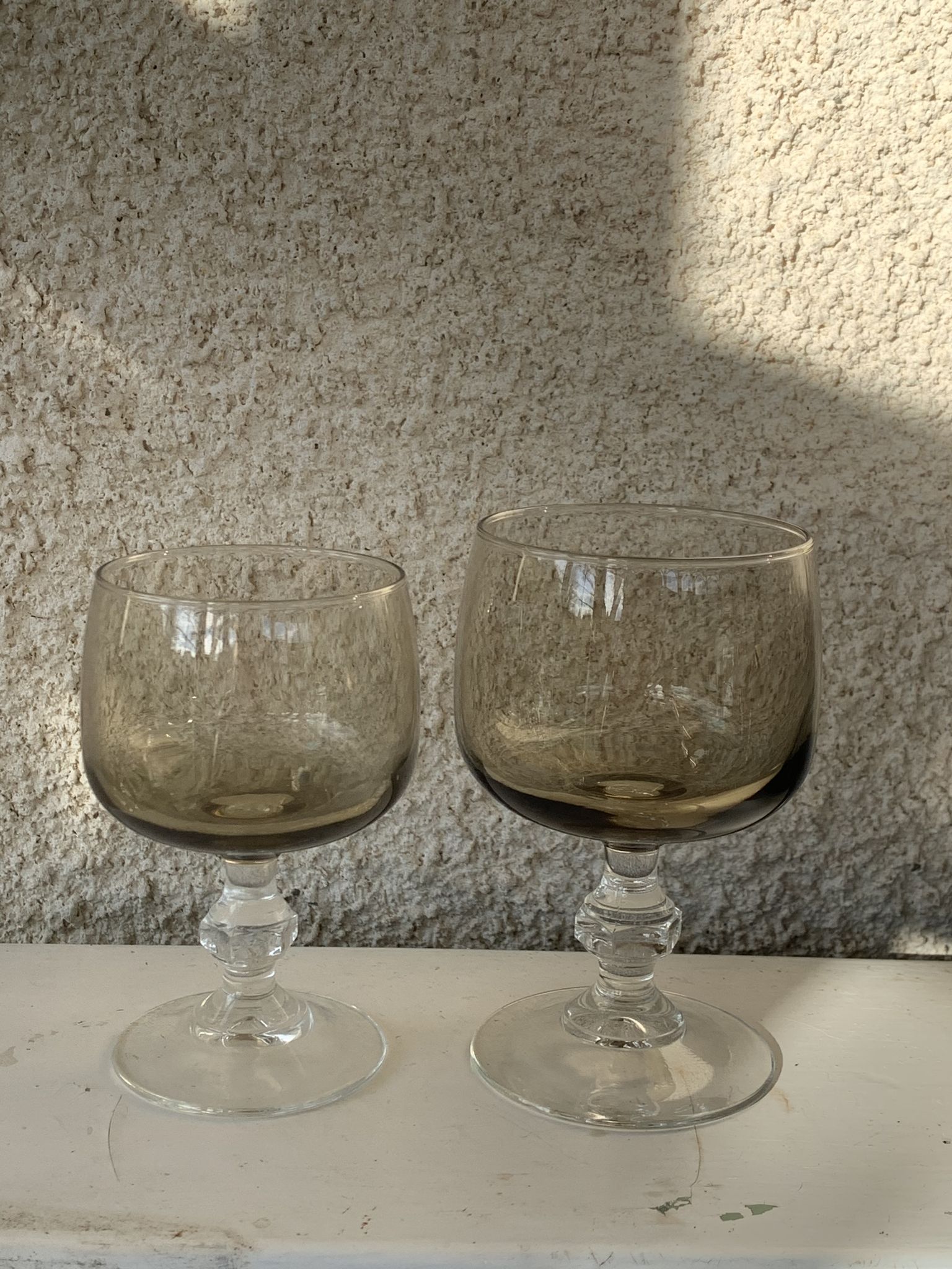 11 wine and water glasses in smoked grey glass and transparent base vintage 1970