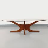 Vintage Hugues Poignant oval coffee table in teak and smoked glass from the 1970s