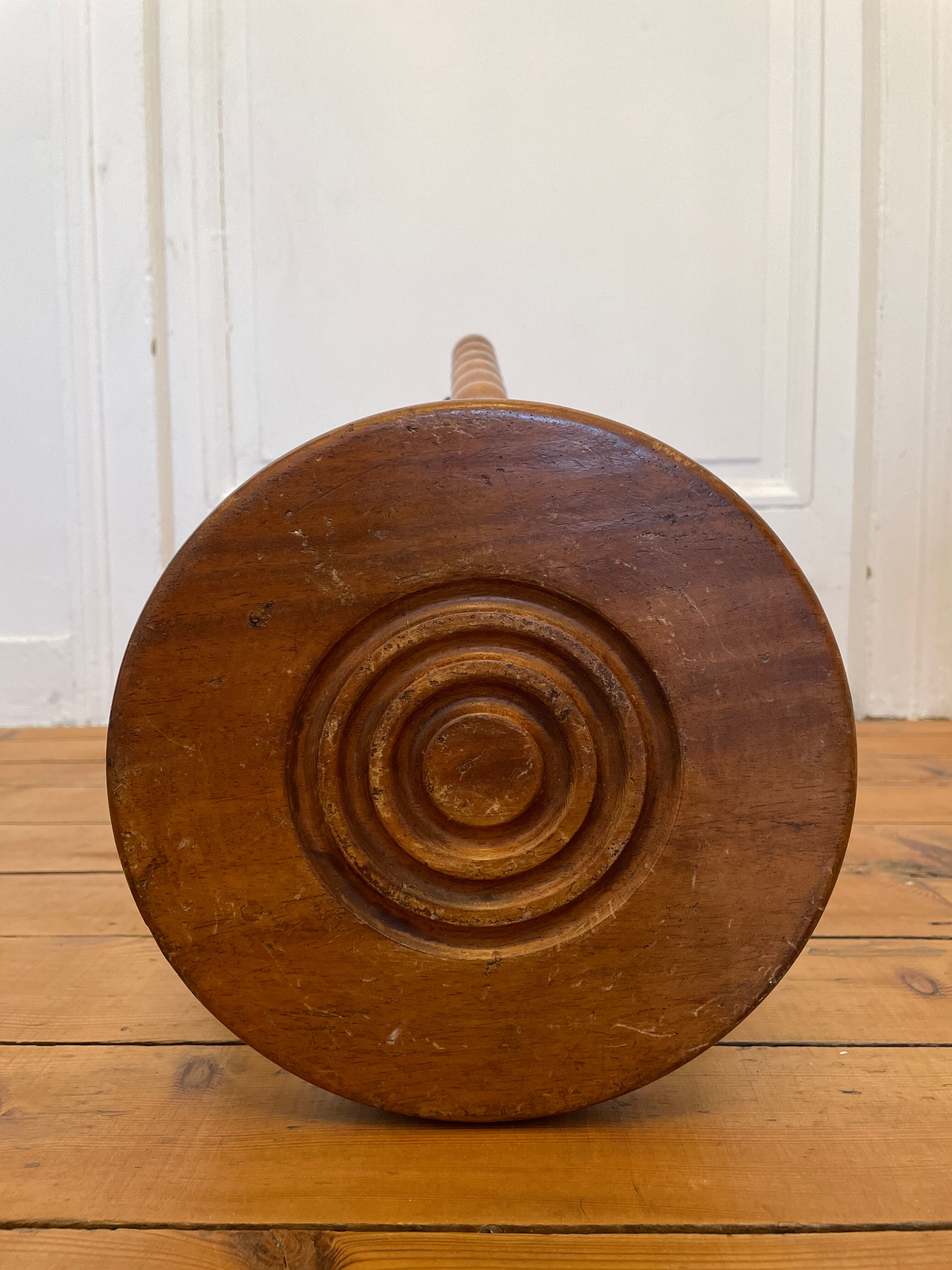 Old wooden tripod stool