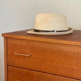 Vintage 1960s chest of drawers with covered handles.