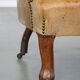 Antique sheep leather club chair/armchair on wheels