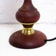 Turned wood and pink glass lamp