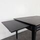 Large flat desk in Louis XVI style, black lacquered with gold highlights.