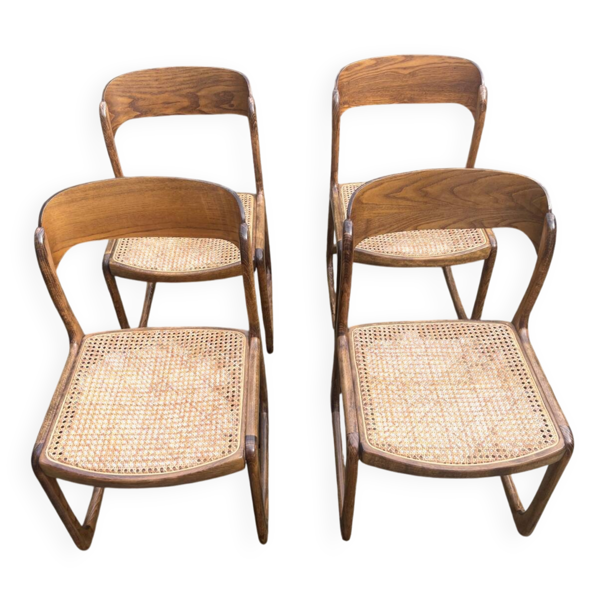 4 magnificent Baumann sled chairs, with caning.