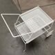 Mid-century modern minimalist perforated metal bar cart from the 1960s.
