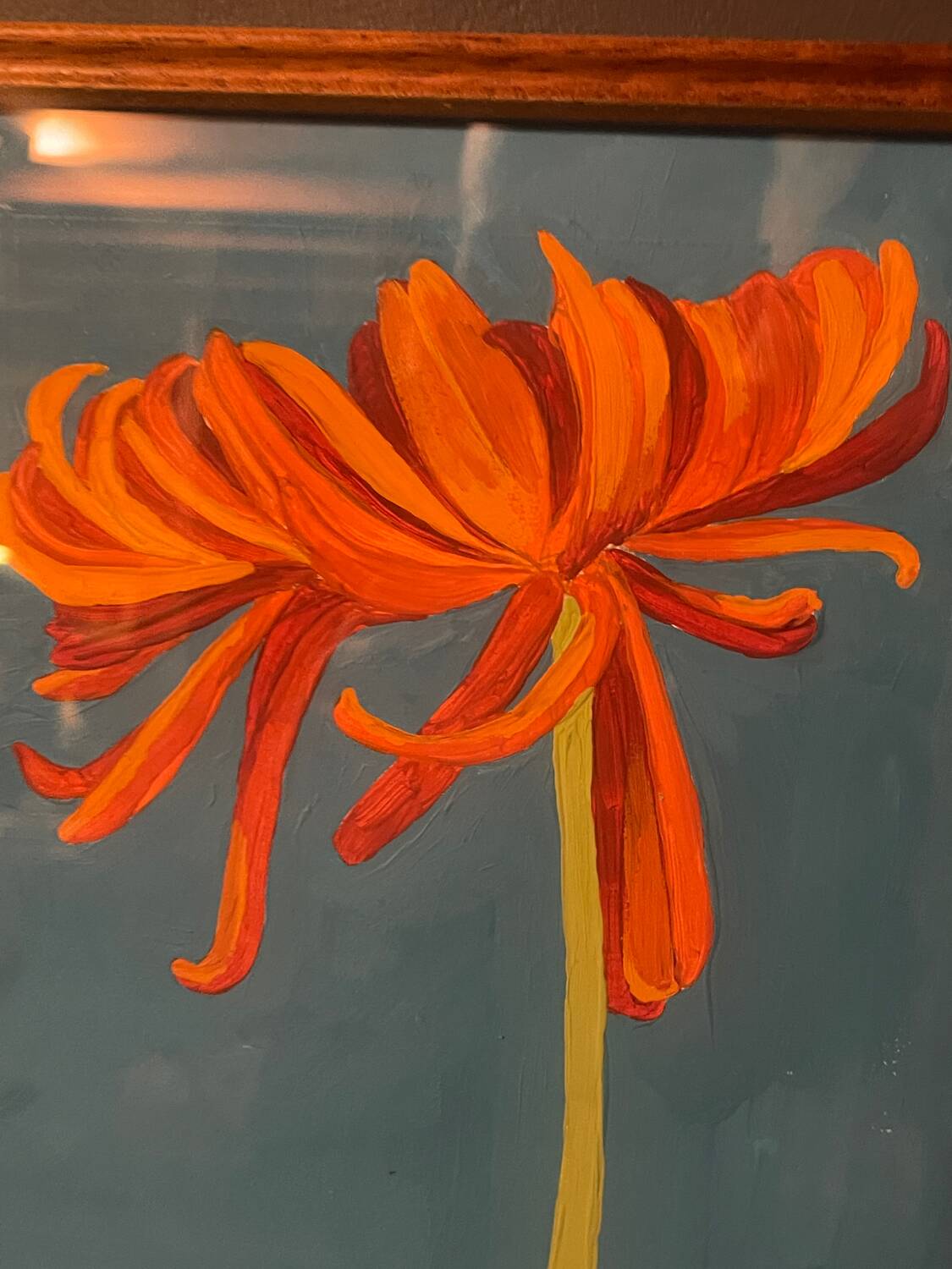 2 paintings of orange dahlias in antique wooden frames