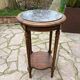 Old wooden pedestal table with marble top