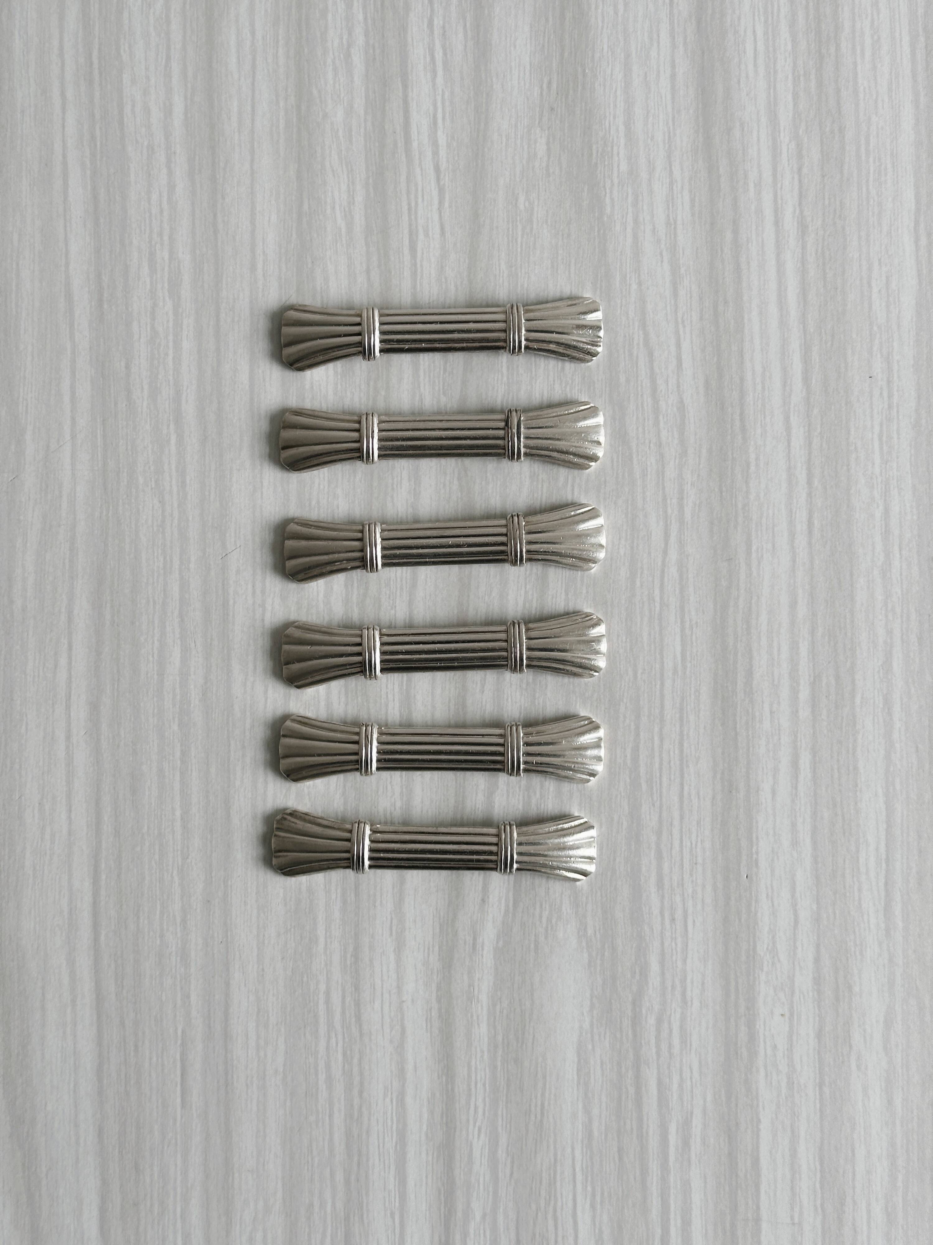 6 silver metal knife holders