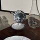 Vintage silver-plated shell butter dish with transparent bowl.