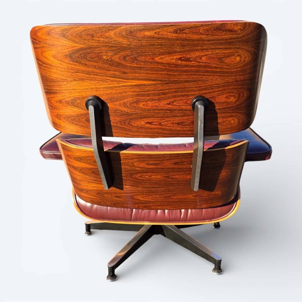 Original Eames lounge chair by Herman Miller in burgundy rosewood.