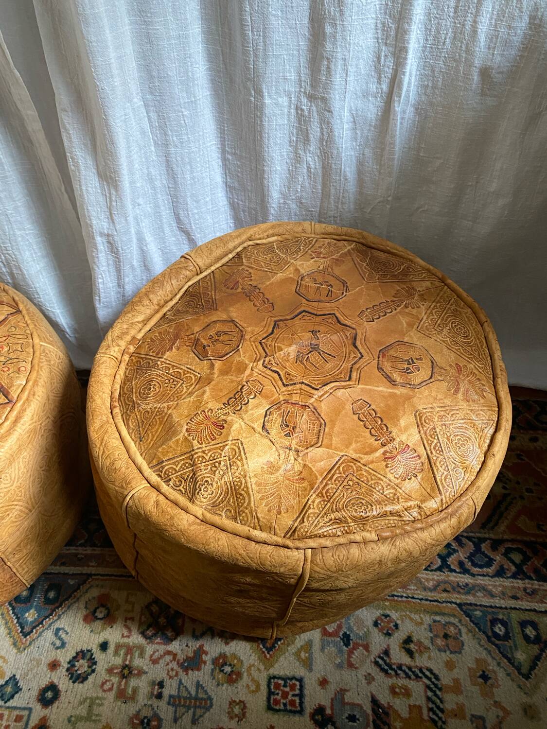 Pair of leather poufs