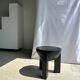 Black mango wood tripod side table with a semi-spherical top, height: 45 cm, diameter: 44 cm.