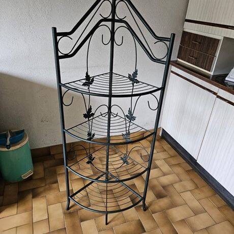 Dark green wrought iron shelf