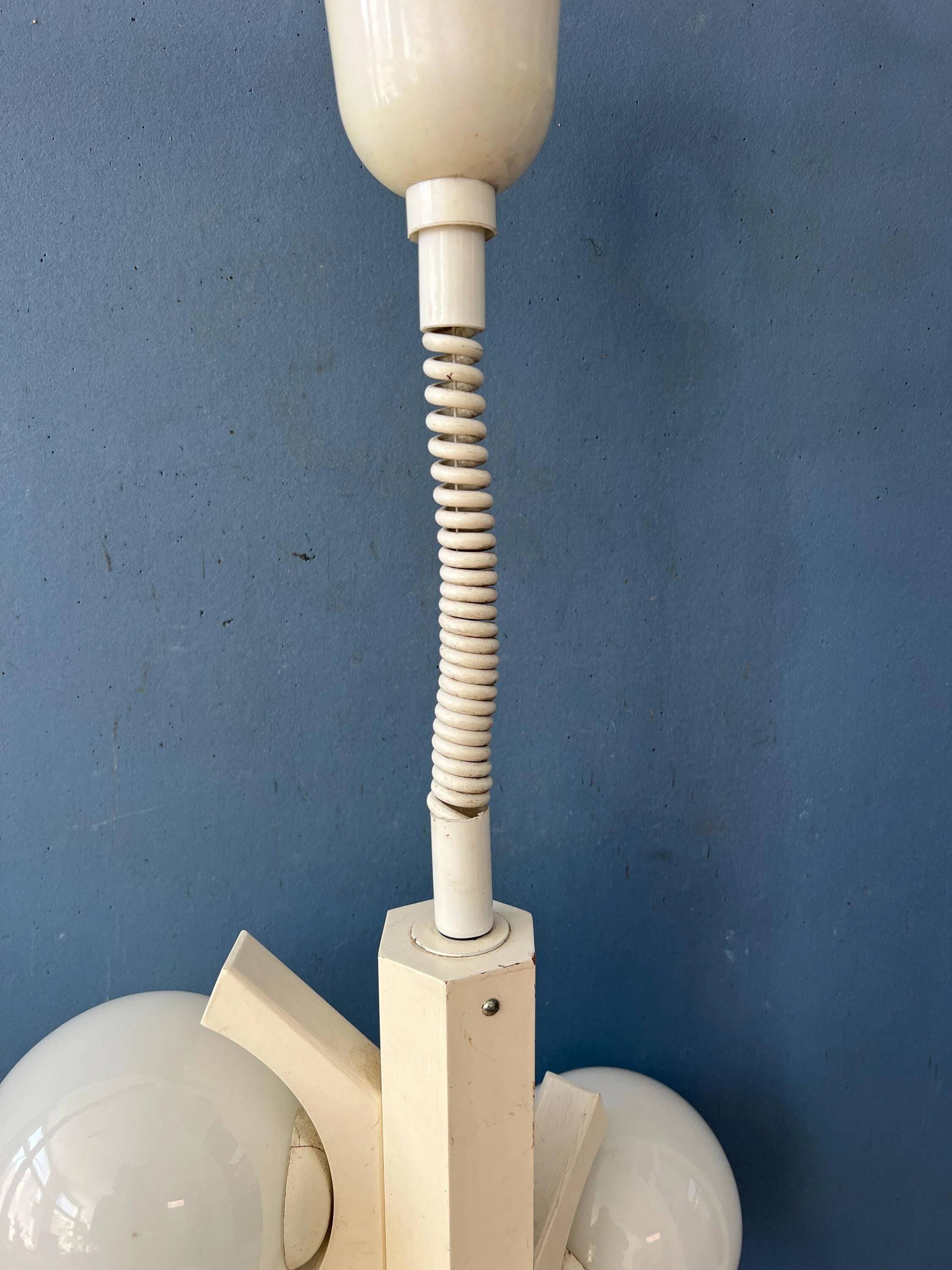 Mid-century white suspension with a bony design and opaline glass shade.