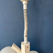 Mid-century white suspension with a bony design and opaline glass shade.