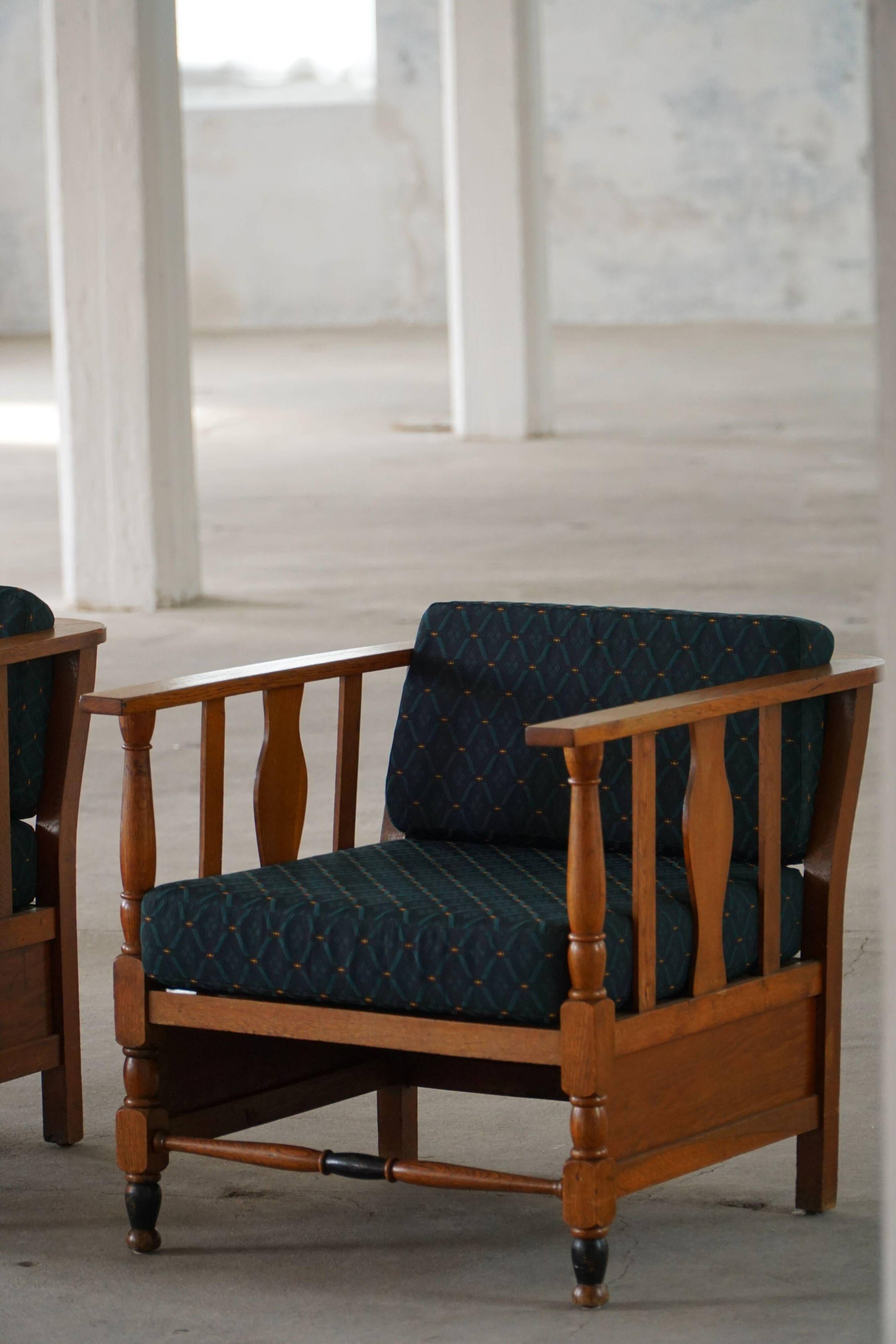 Art Nouveau, pair of oak lounge chairs, reupholstered in style fabric, 1920s.