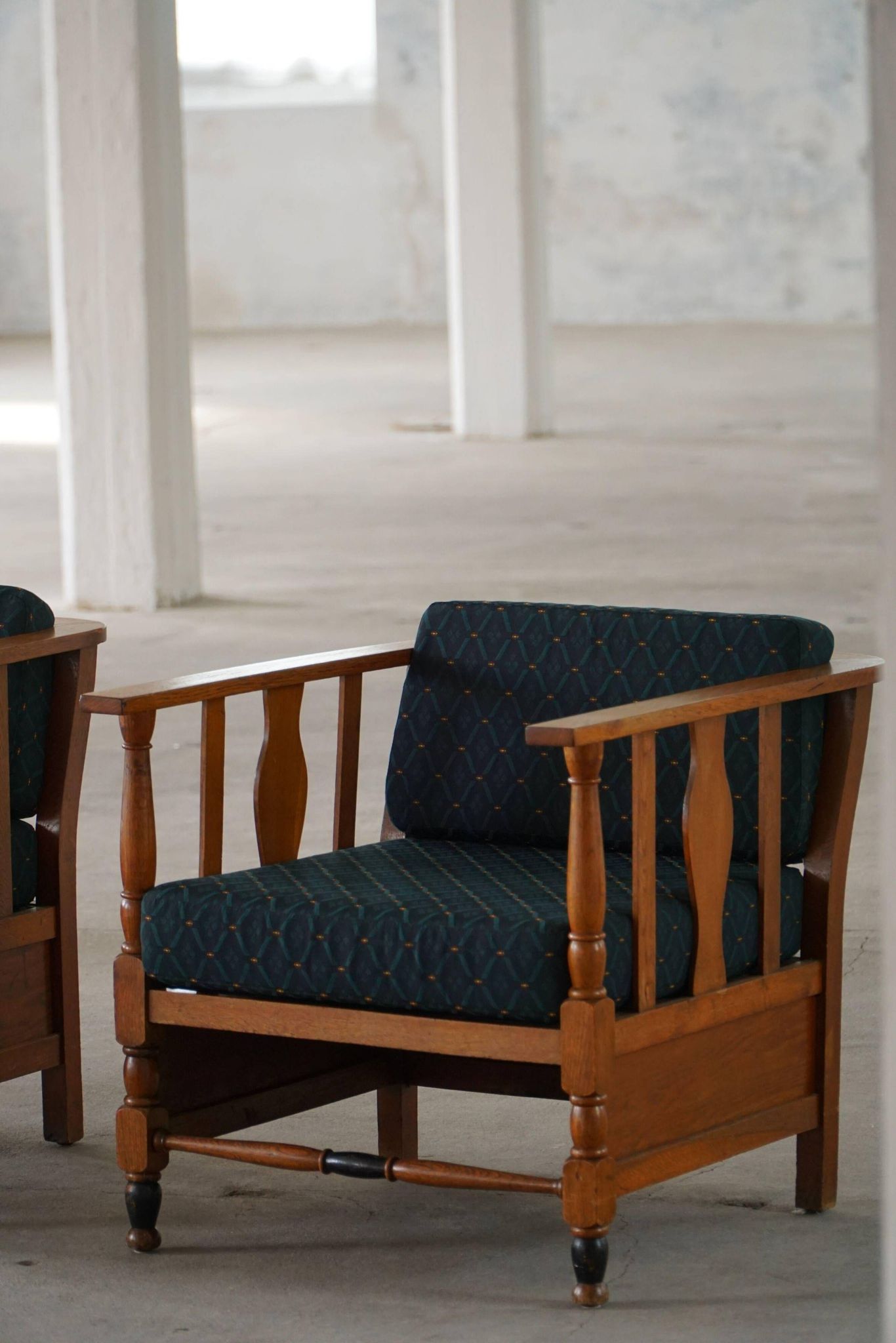 Art Nouveau, pair of oak lounge chairs, reupholstered in style fabric, 1920s.