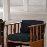 Art Nouveau, pair of oak lounge chairs, reupholstered in style fabric, 1920s.
