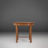 Timeless French Art Deco carved oval side table in oak, 1930s