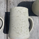 Set in stoneware cups and pitcher