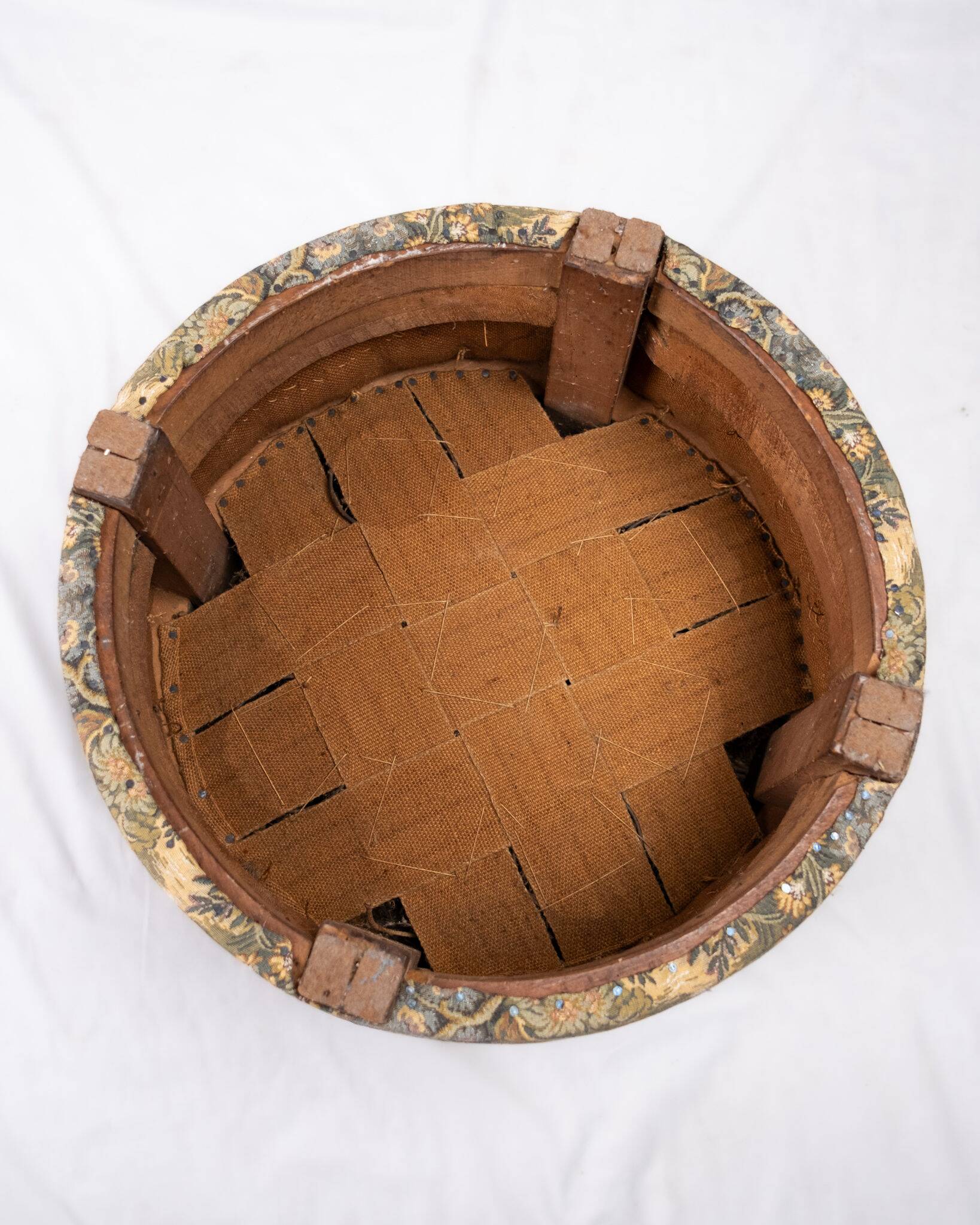 Upholstered pouf in verdure tapestry style, France, late 19th century.