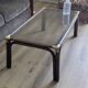 Bamboo coffee table with brass corners and smoked glass