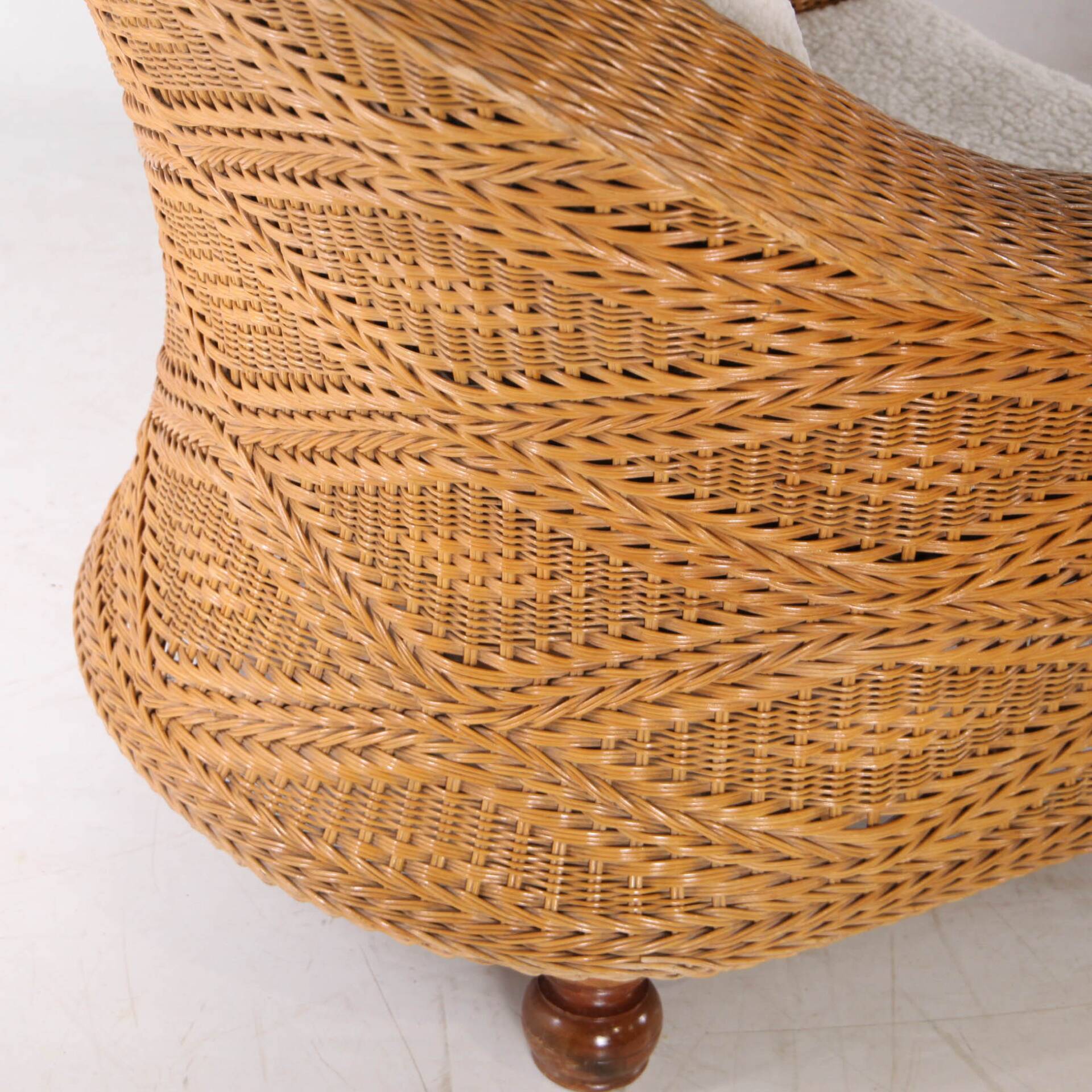 Pair of woven wicker armchairs