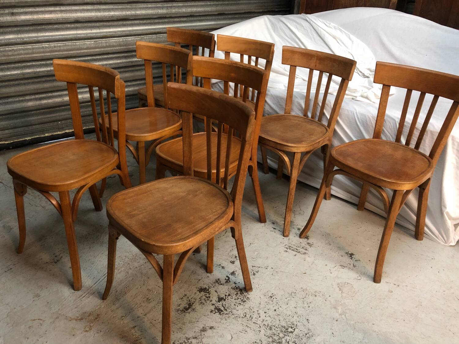 8 antique Baumann bistro chairs