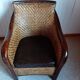 Fauteuil rotin tressé et bois exotique