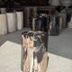 Black petrified wood side table with beige stripes, star pattern H35 D24.