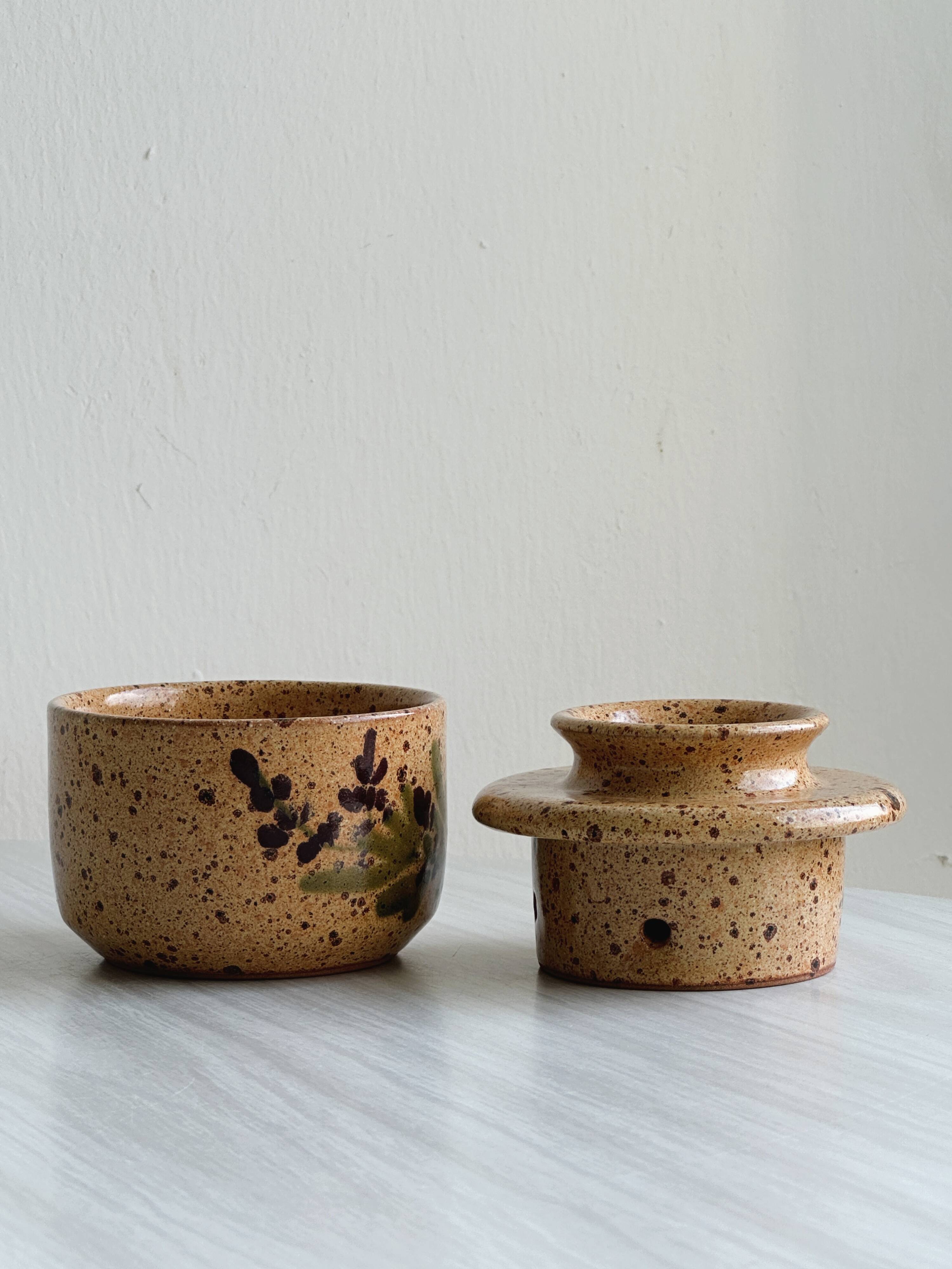 Small speckled ceramic butter dish, hand-painted decoration.