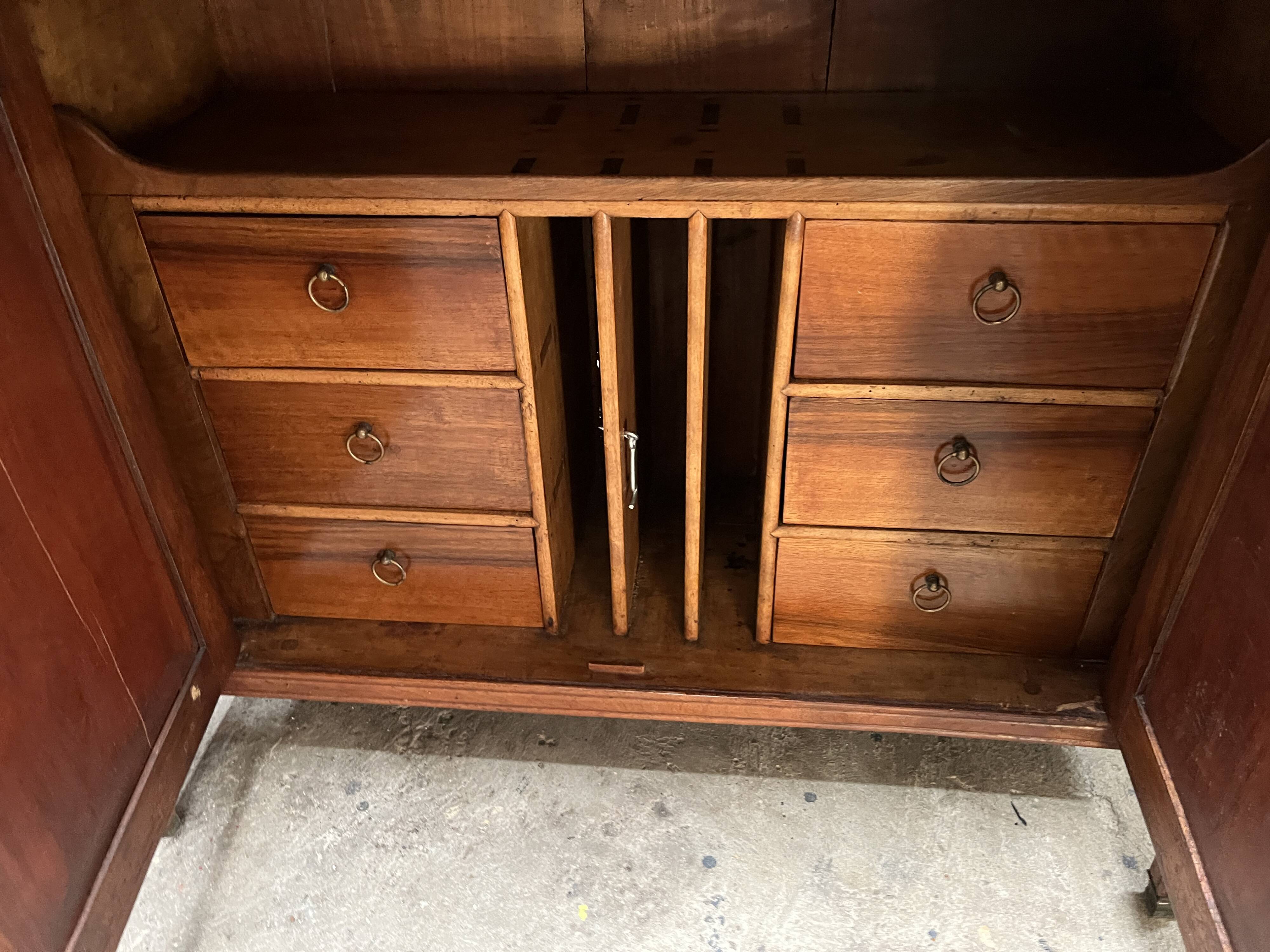 Victorian English two-body buffet with cherry wood on marble display case from the 19th century.