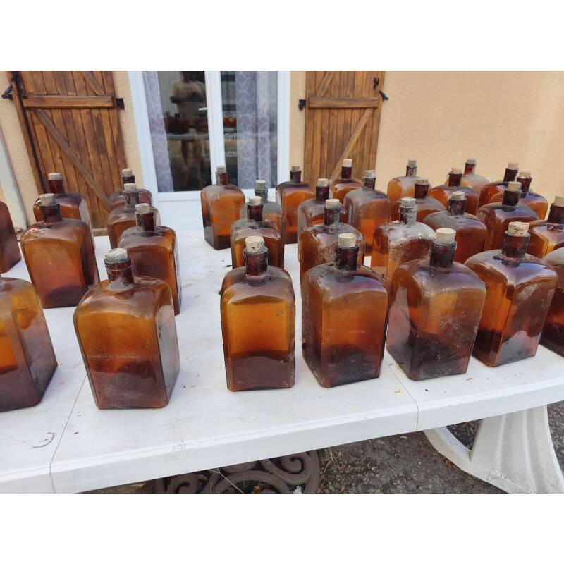 Set of 41 brown glass pharmacy bottles.