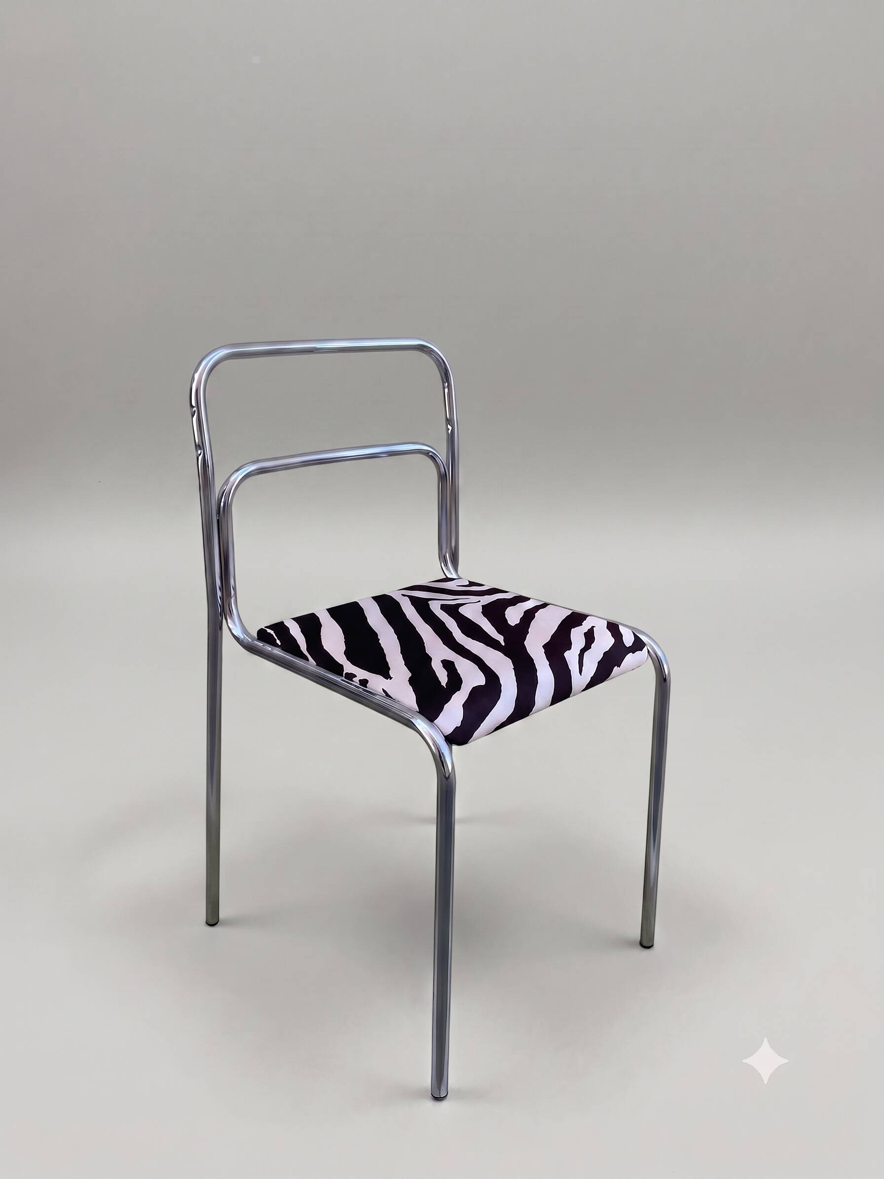 Chrome chair in Bauhaus style with zebra fabric