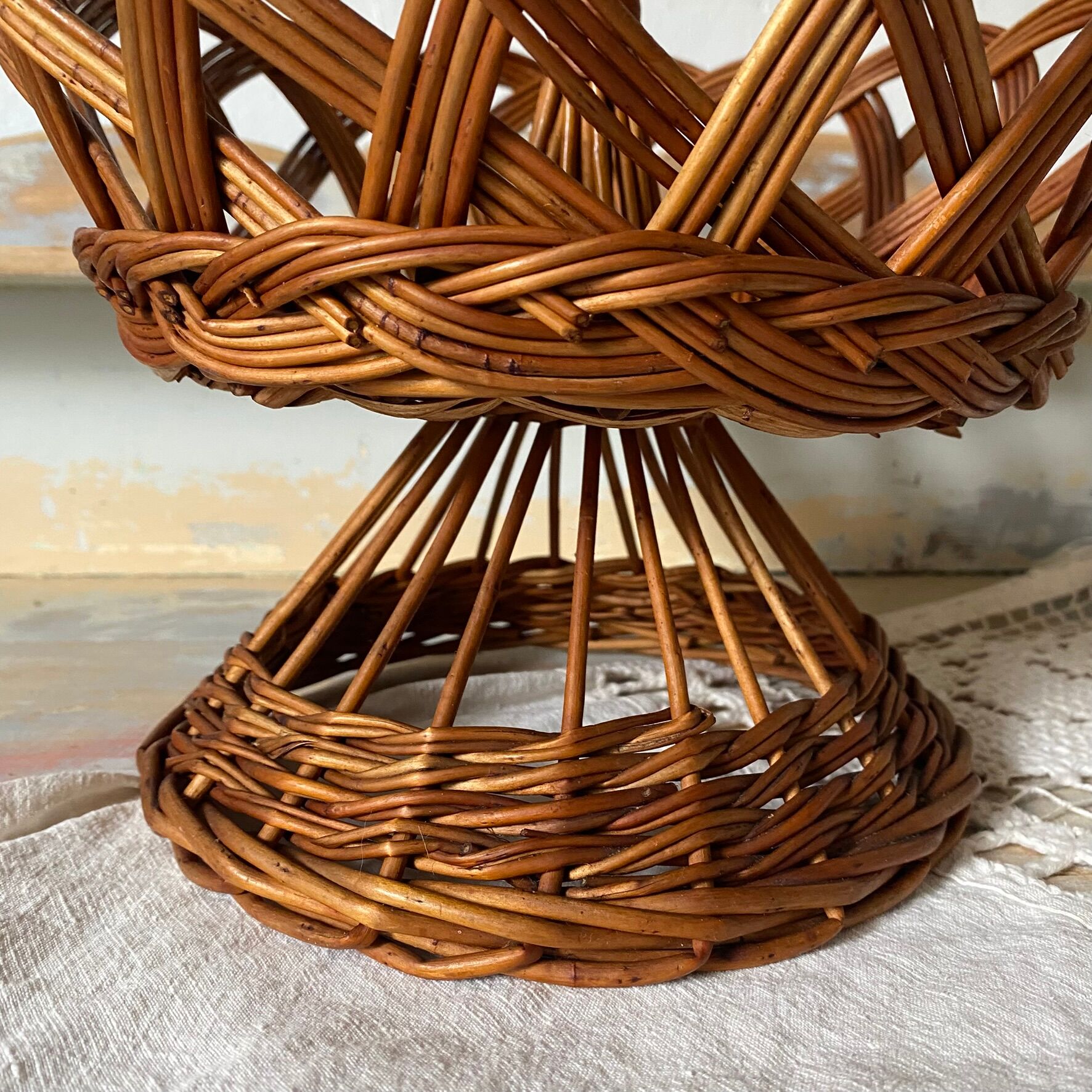 Wicker fruit bowl on a stand