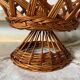 Wicker fruit bowl on a stand