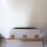 Old wall coat rack in raw wood